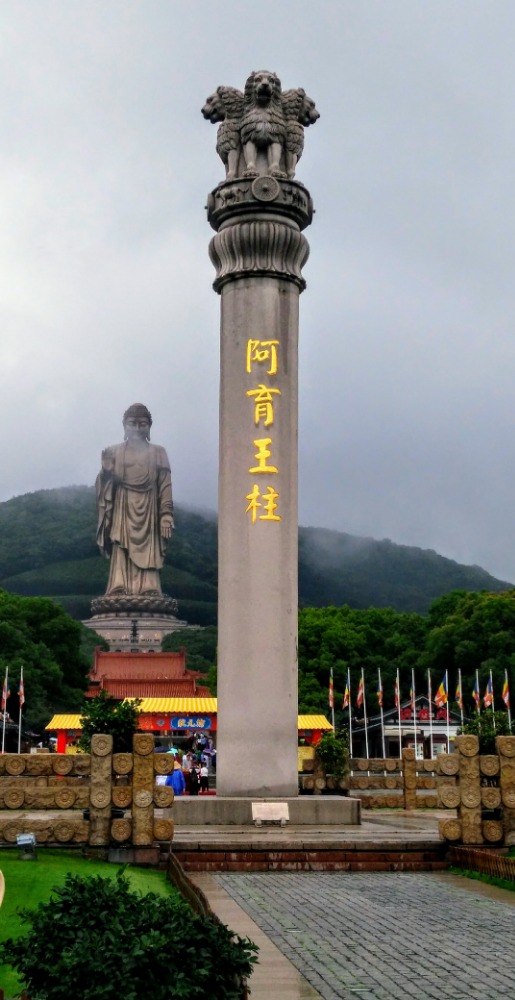 The great monument of King Ashoka aside the huge statue of Lord Buddha